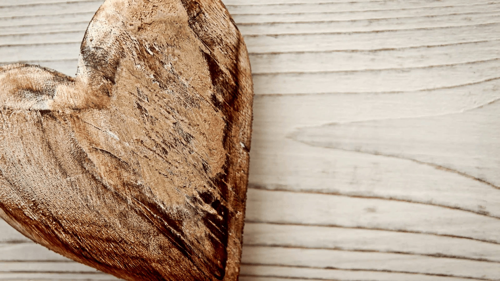 wooden love heart background hd stock footage a rustic love heart crafted from wood set against a wooden rustic backdrop with a sliding camera move v2ezet3vpl F0000
